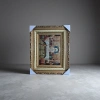 The golden carved photo frame is set with a religious brocade painting of the Last Supper, an arched window and a starry sky background Application Scenario